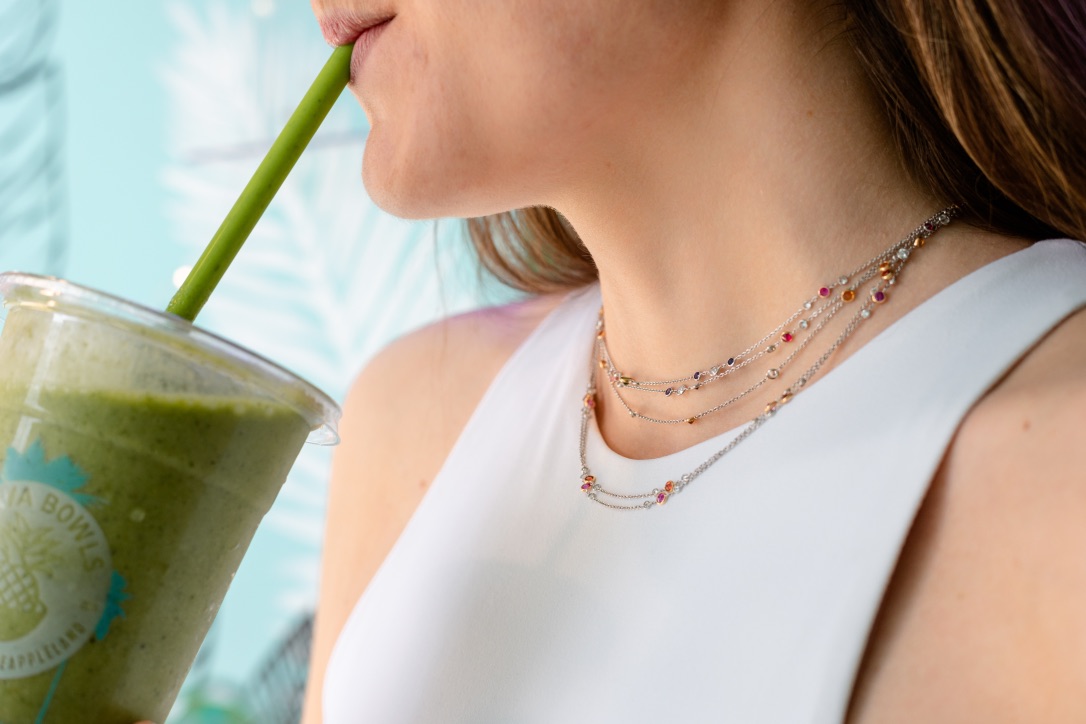 Layered diamond and gemstone necklaces.