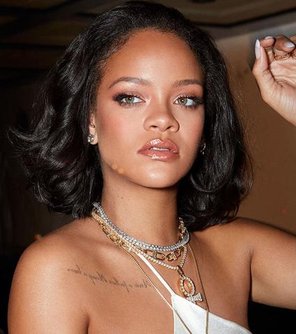 Rihanna in layered necklaces.