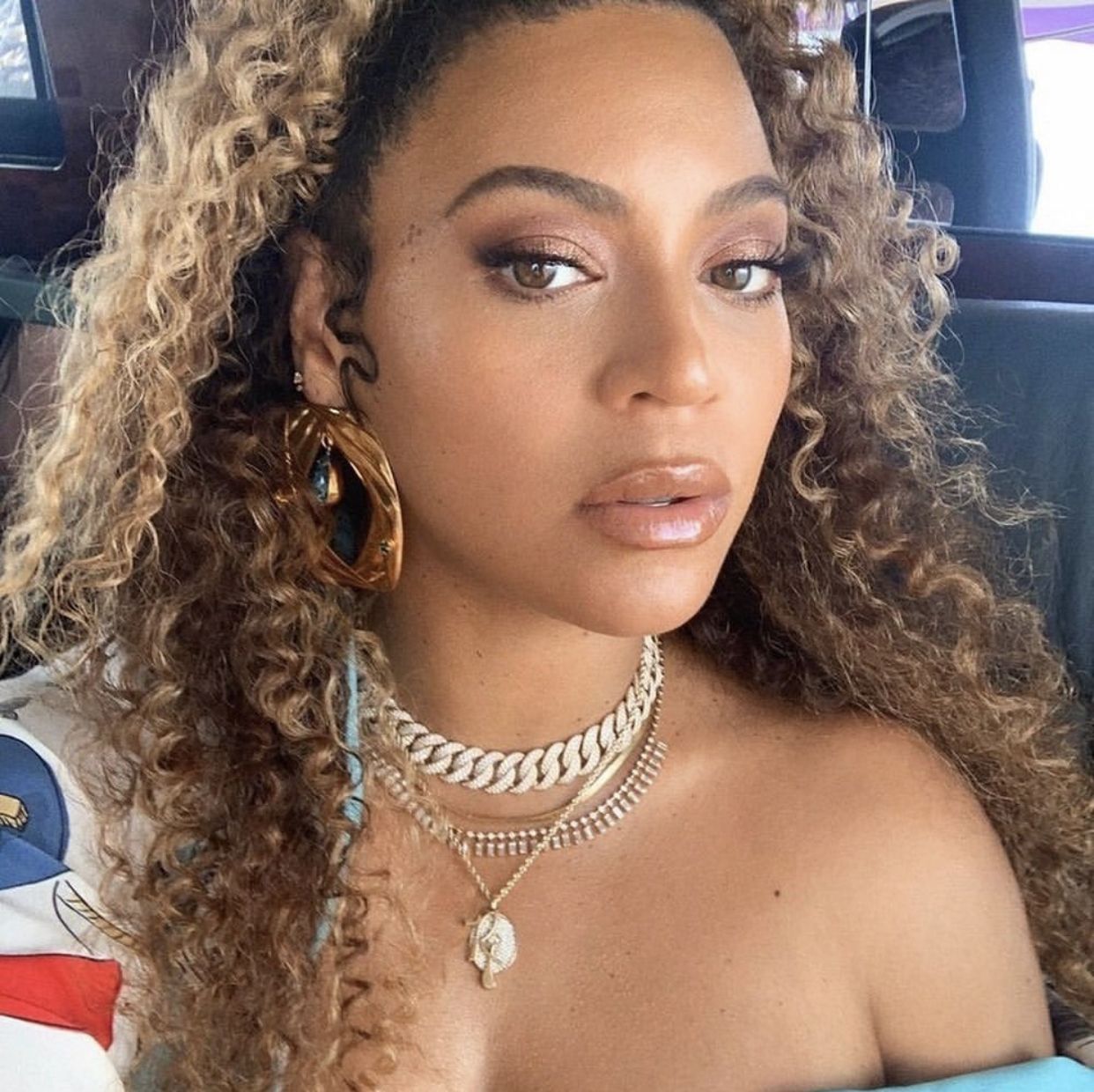 Beyonce in layered necklaces.