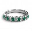 An 18k White Gold Emerald And Diamond Band