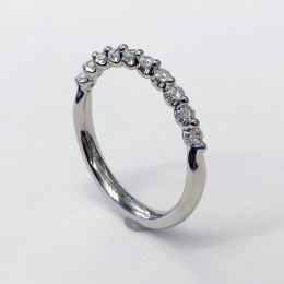 A Platinum 15 Stone Diamond Wedding Band