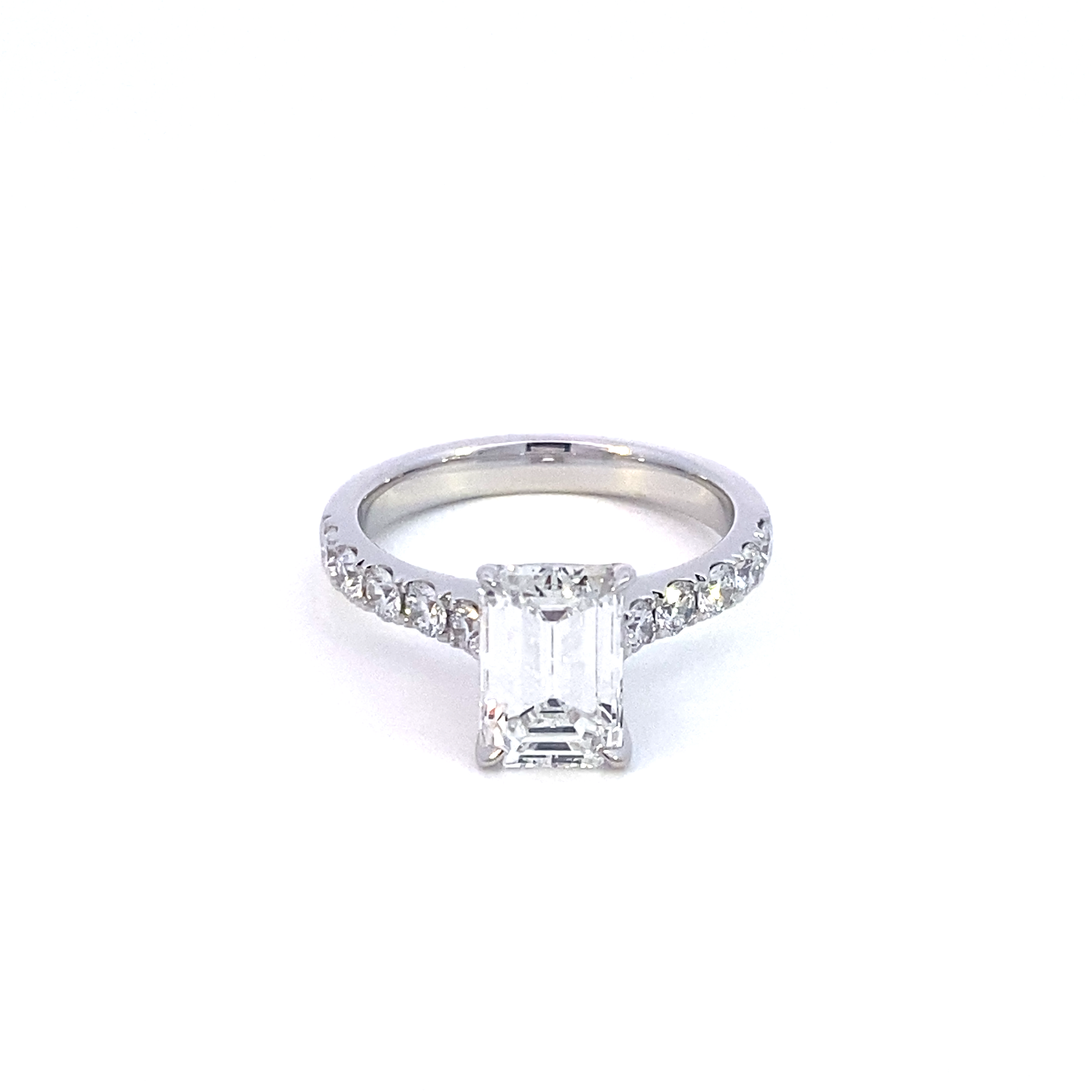 A Platinum Emerld Cut Engagement Ring 