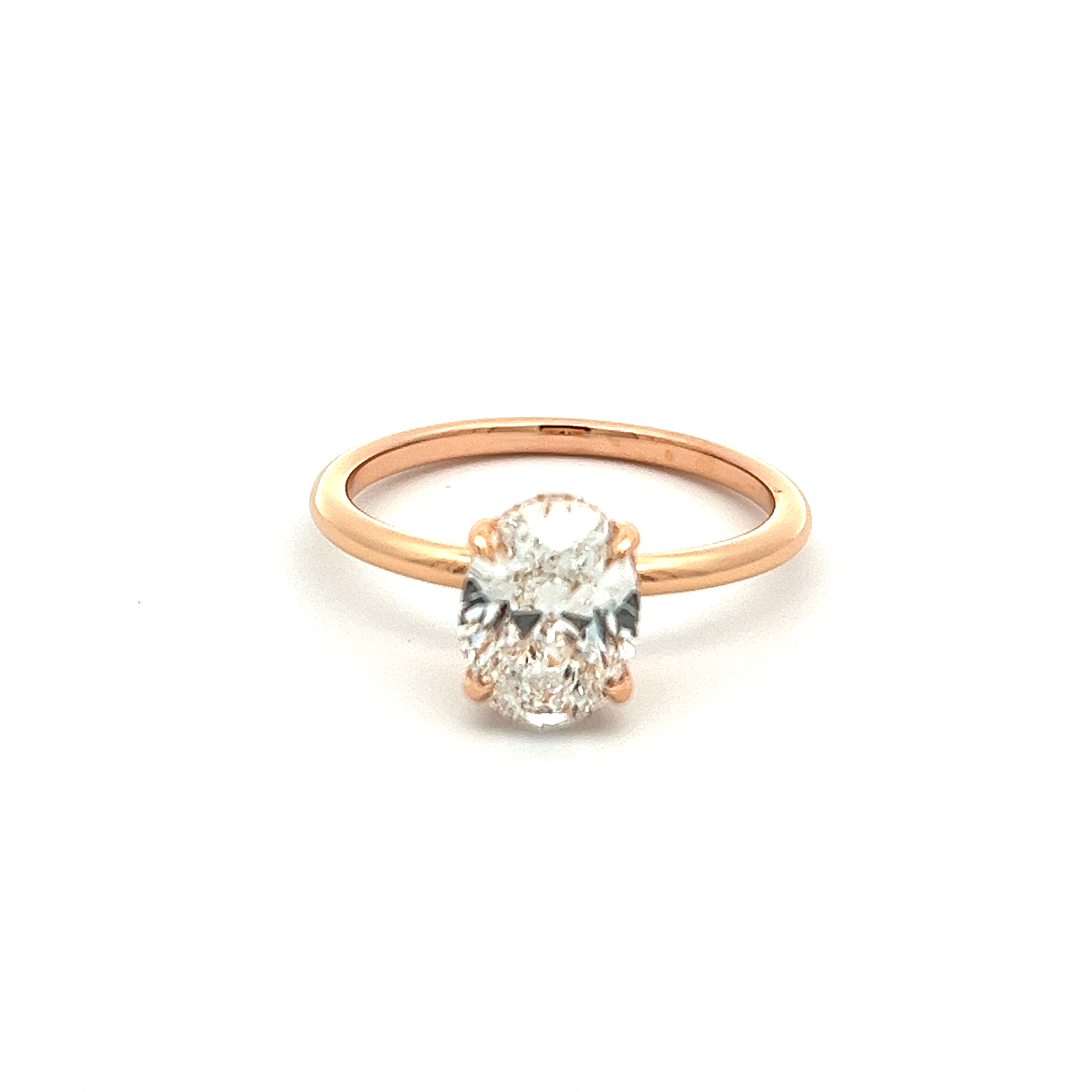 An 18k Rose Gold Oval Diamond Engagement Ring