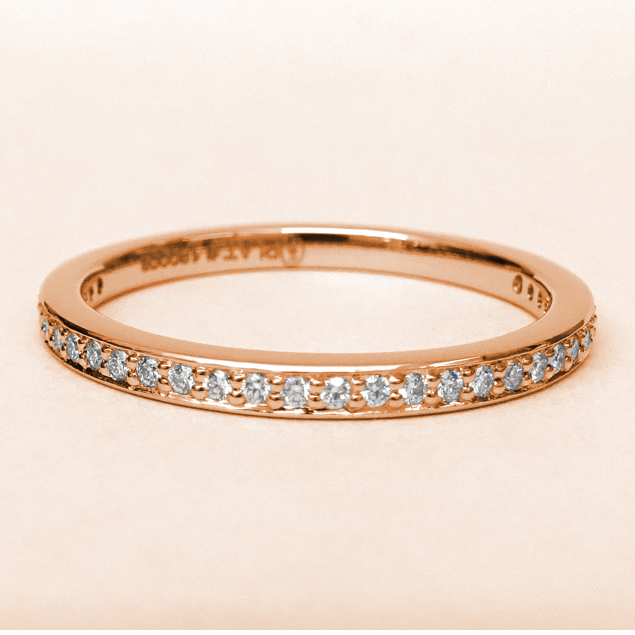 An 18k Rose Gold Diamond Band