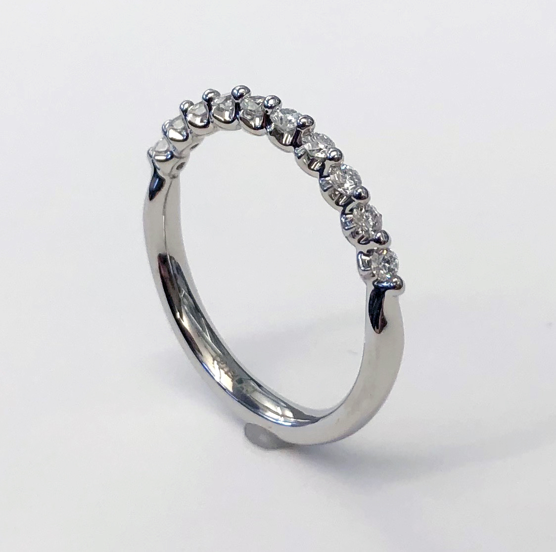 A Platinum 15 Stone Diamond Wedding Band