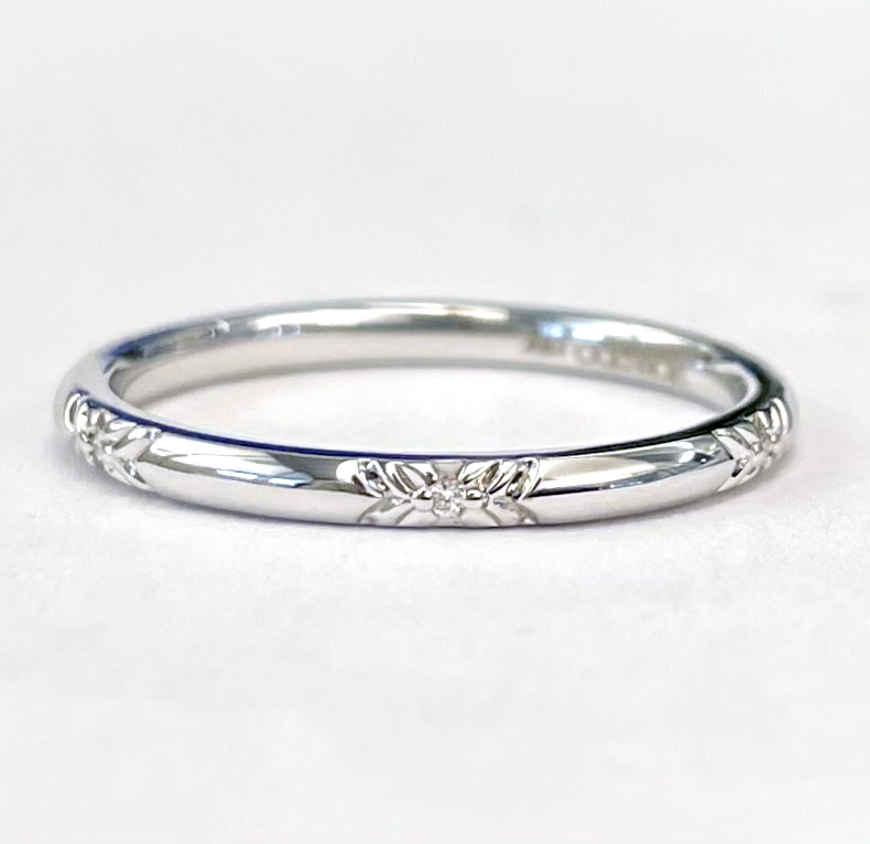 An 18k White Gold Diamond Band